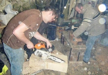James and Cathal chainsawing one of the new blocks, while Brian continues the chiselling of his hull. Photo: SR.